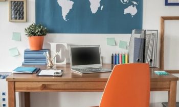 A styled office with world map background for the blog post Remote Bilingual Jobs You Can Do From Home