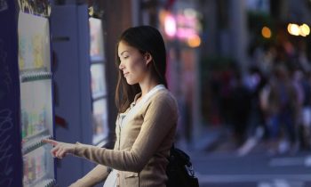 Woman using a vending machine.