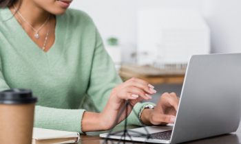 Nurse working from home on laptop