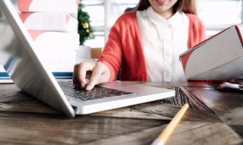 online craft seller creating a shipping label on her laptop