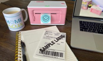 Workspace with laptop, coffee, notebook, and MUNBYN thermal label printer