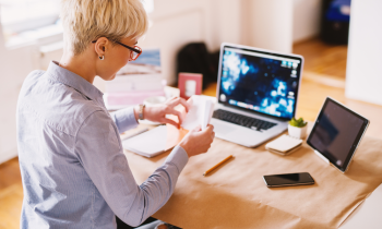 woman working from home stuffing envelopes